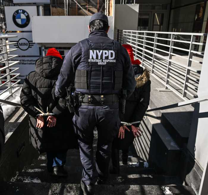 a police officer walking down a set of outdoor stairs