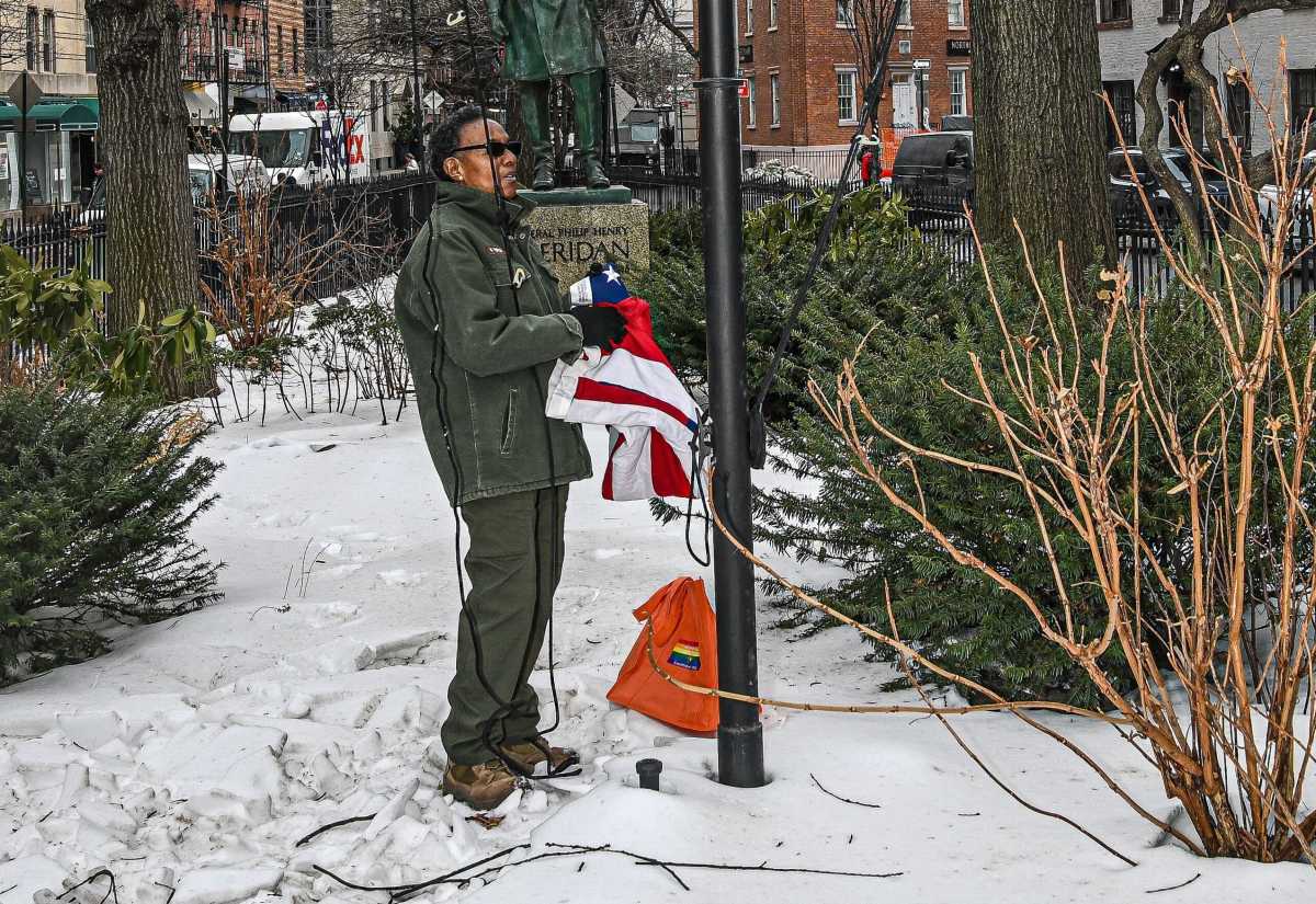 Federal worker with American flag at Stonewall site days after Pride flag removed