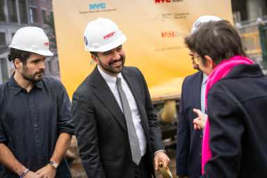 Mayor Zohran Mamdani speaking at an event in a hard hat