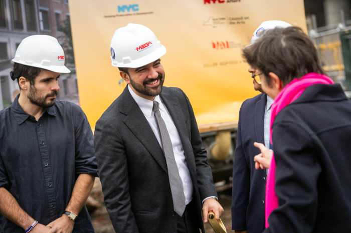 Mayor Zohran Mamdani speaking at an event in a hard hat