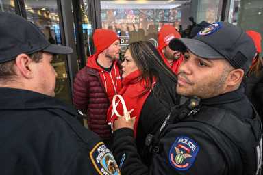 police arresting a group of people nurses
