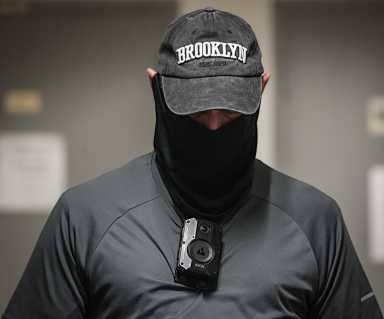 person wearing a hat and mask