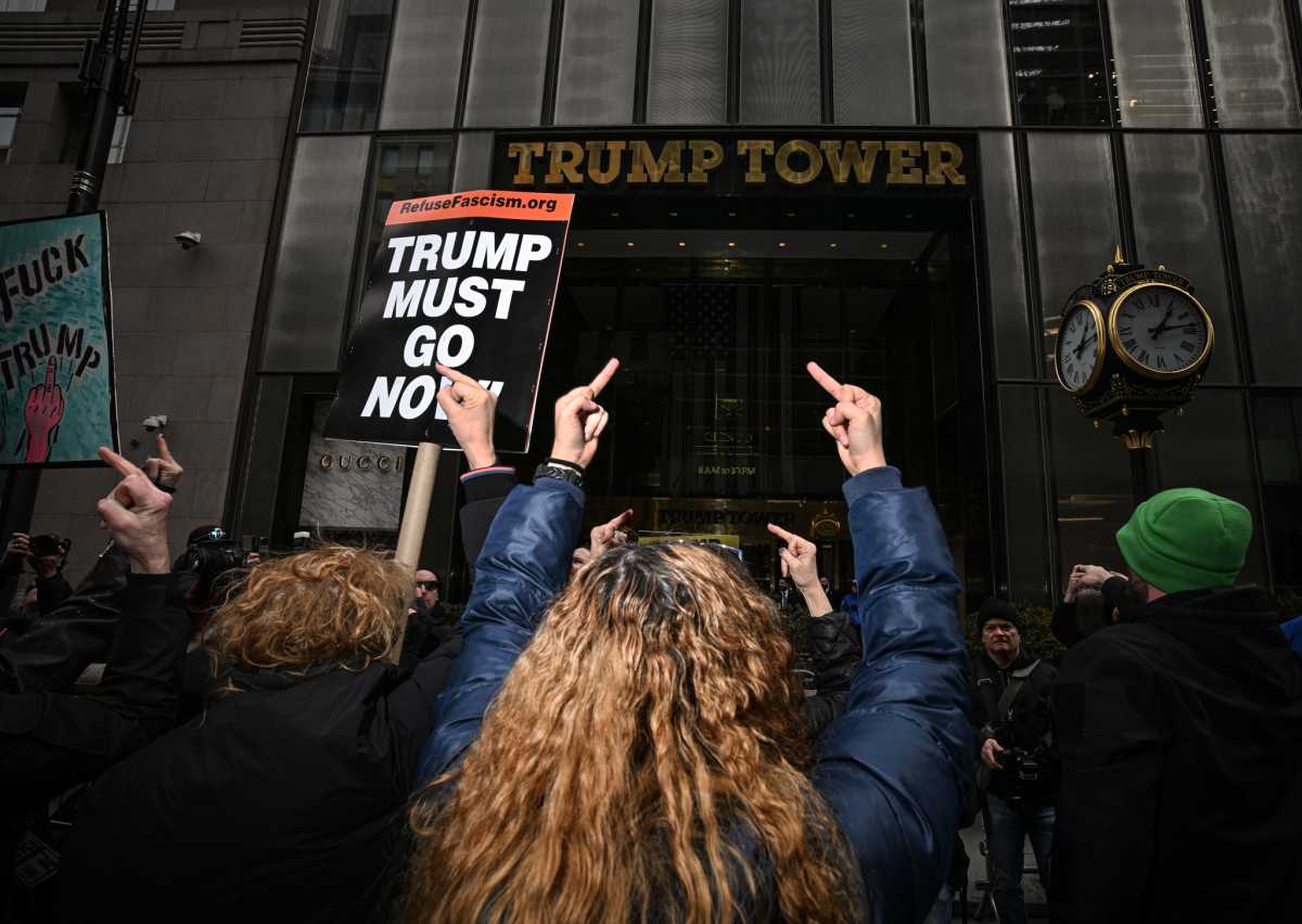 Fingers of fate: Hundreds flip the bird at Trump Tower in crass Presidents' Day protest against Donald Trump 5