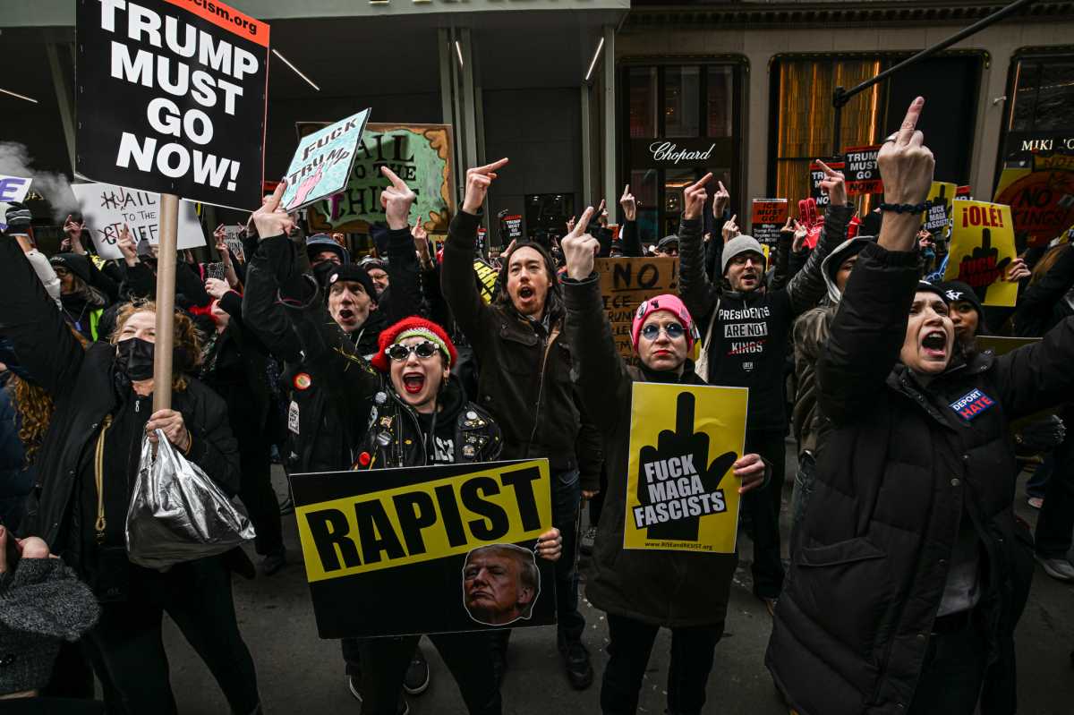 Fingers of fate: Hundreds flip the bird at Trump Tower in crass Presidents' Day protest against Donald Trump 3