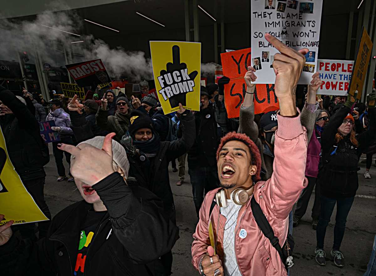 Fingers of fate: Hundreds flip the bird at Trump Tower in crass Presidents' Day protest against Donald Trump 4