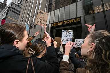 People give middle finger at Trump Tower on Presidents Day during anti-Donald Trump demonstration