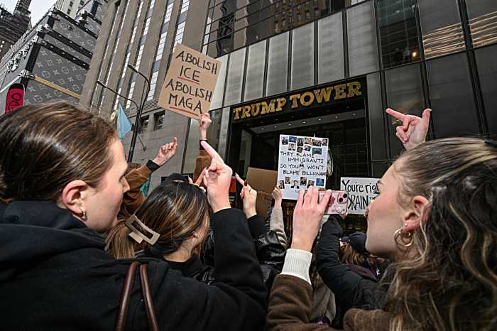 People give middle finger at Trump Tower on Presidents Day during anti-Donald Trump demonstration