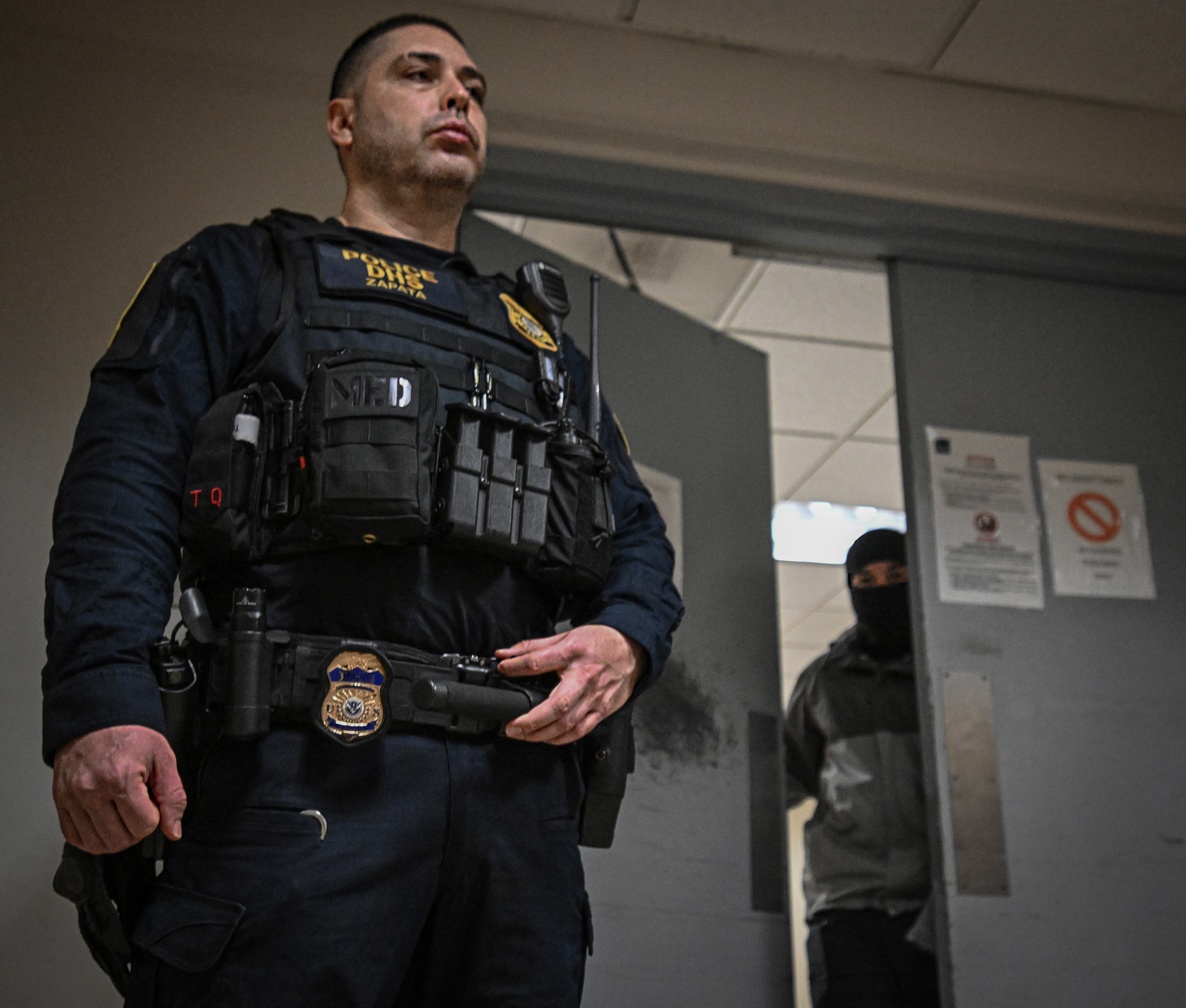 ICE agent on patrol at Federal Plaza where immigrants are being detained