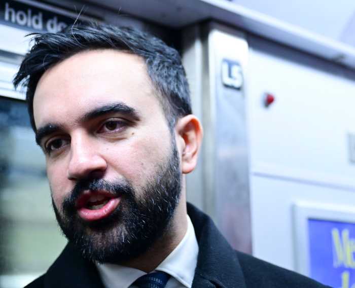 Mayor Zohran Mamdani riding the subway.