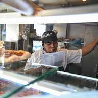 How politicians are preparing Lower East Siders for the inevitability of ICE 5 worker in a dining establishment in the Lower East Side