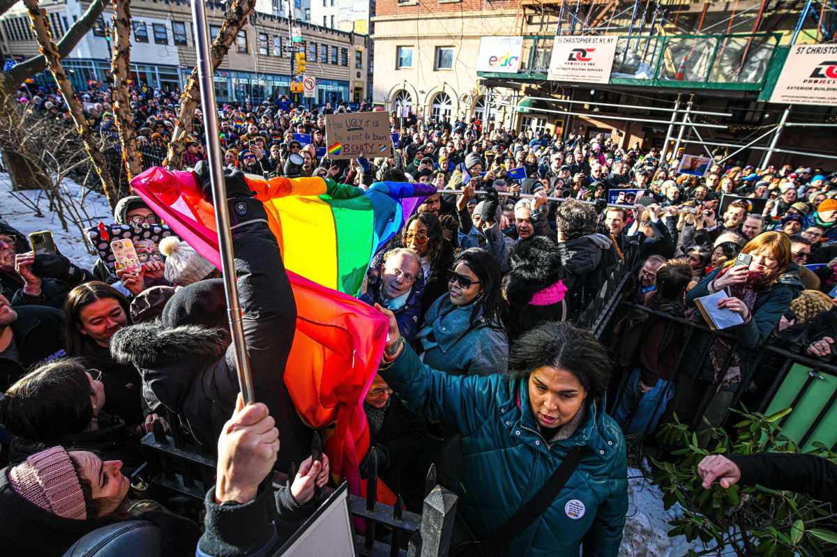 The Pride flag makes its way through the crowd.