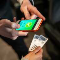 StubHub launches 'Access: New York' fund to send youth across New York state to professional sporting events, concerts, and theater 2 Usher scanning movie tickets on a smartphone in a bustling cinema, ensuring smooth entry for excited moviegoers in the auditorium