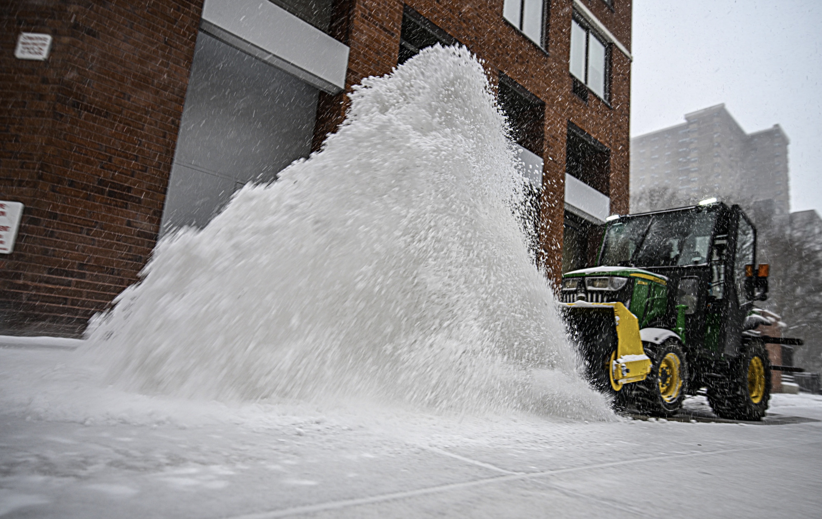 plow gets rid of snow during blizzard in NYC