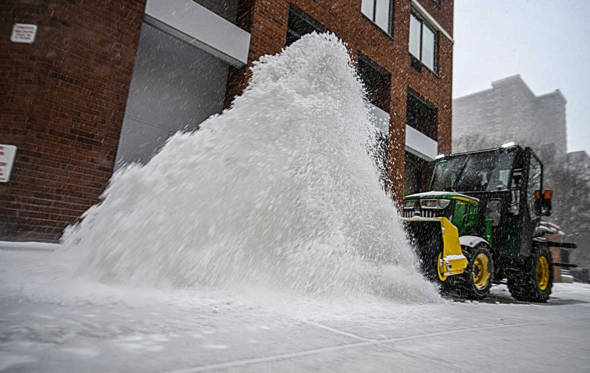 plow gets rid of snow during blizzard in NYC