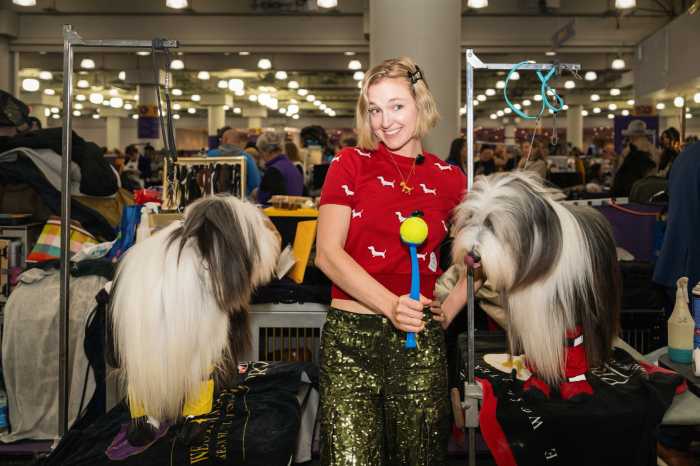 fern watt near two sheep dogs