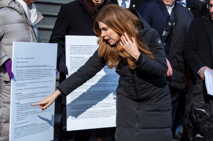 City Council Speaker Julie Menin points to language in a report about 9/11 air quality