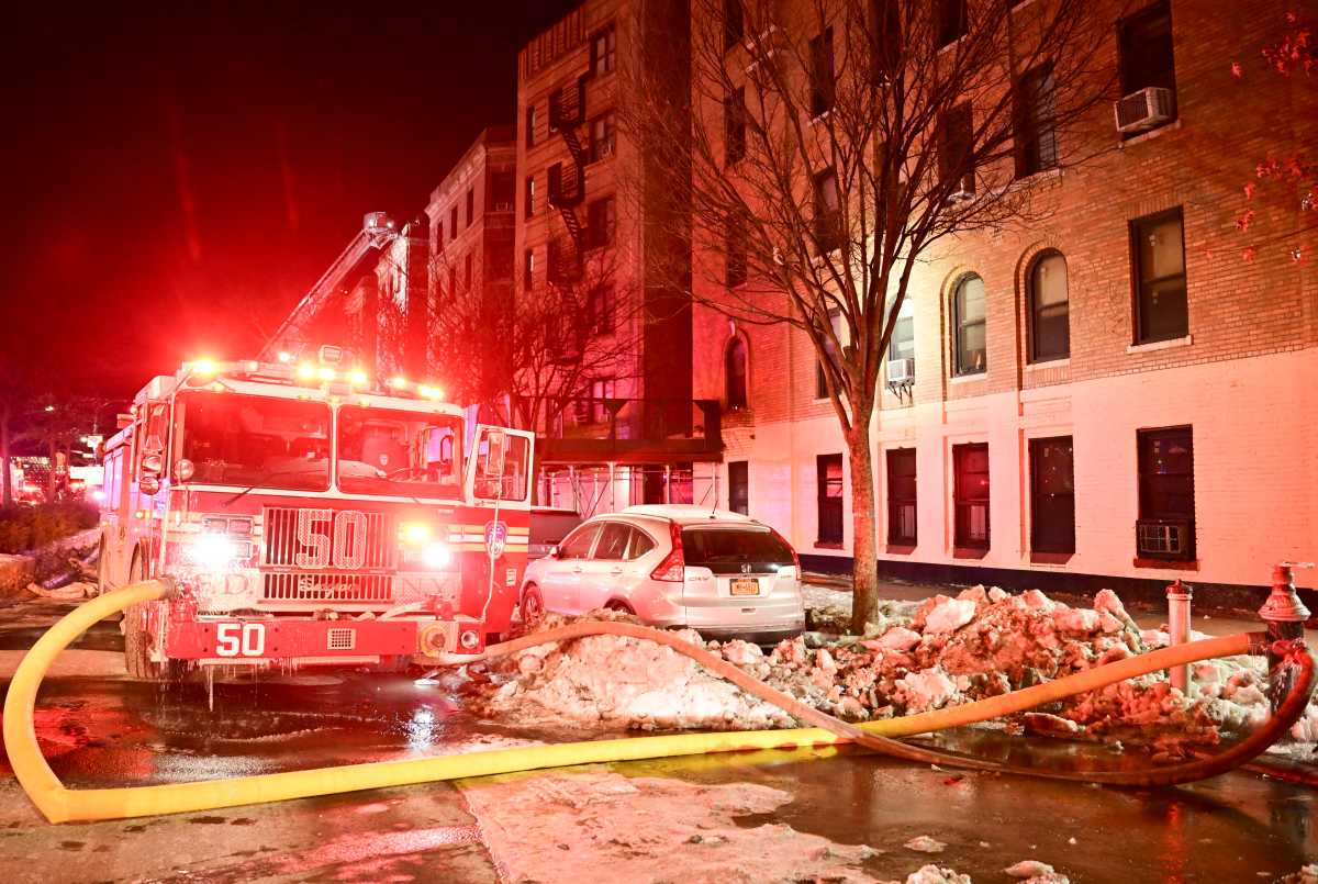 Four-alarm Bronx fire leaves two injured, 30 residents left out in the bitter cold 2 firetruck with hose extended during four-alarm fire in the Bronx