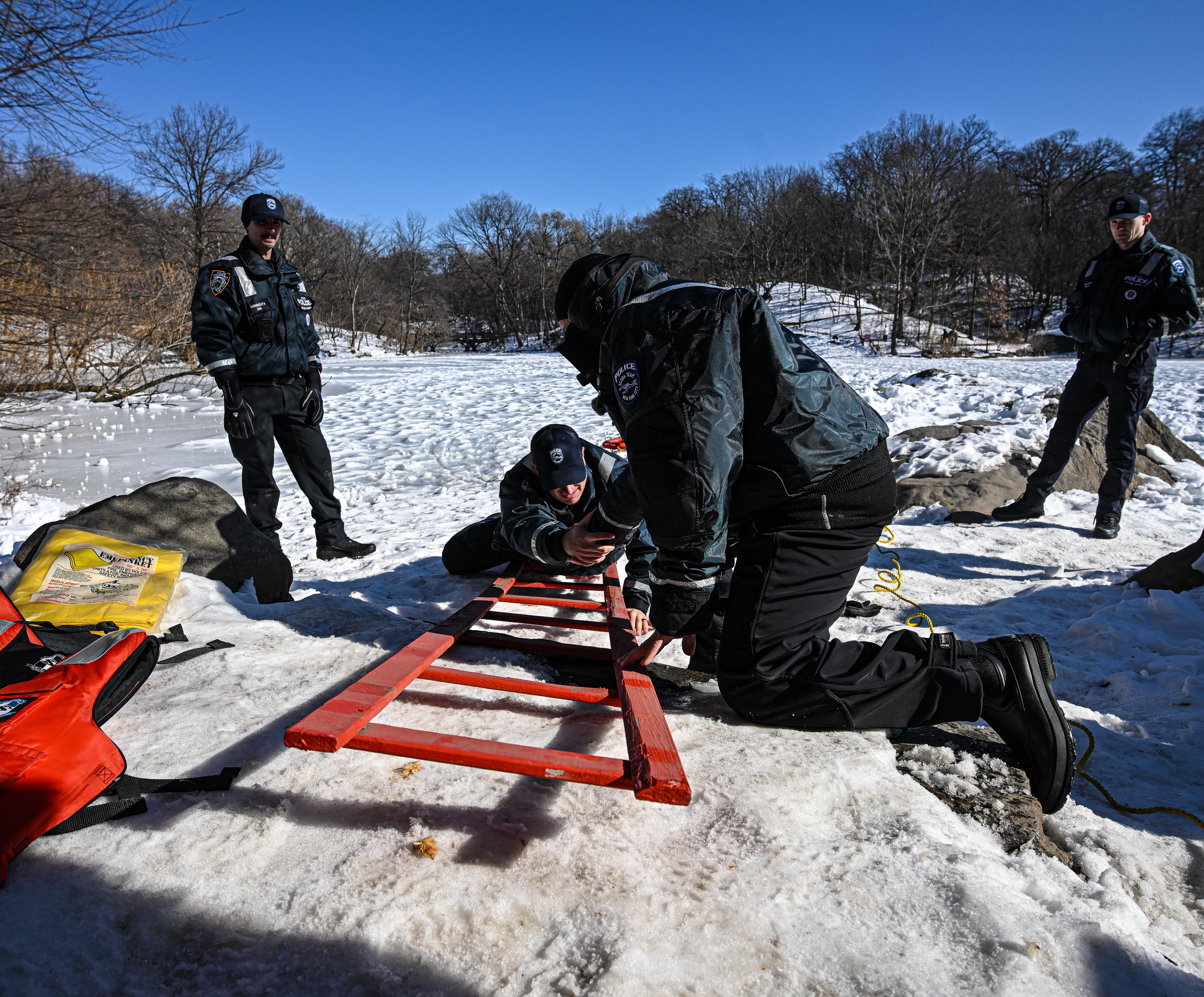 NYPD Harbor Unit members train for water rescues on icy pond