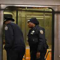 BREAKING: Bronx subway shooting leaves man dead, police sources say 11 FILE - Two police officers investigate a crime scene in a subway car.