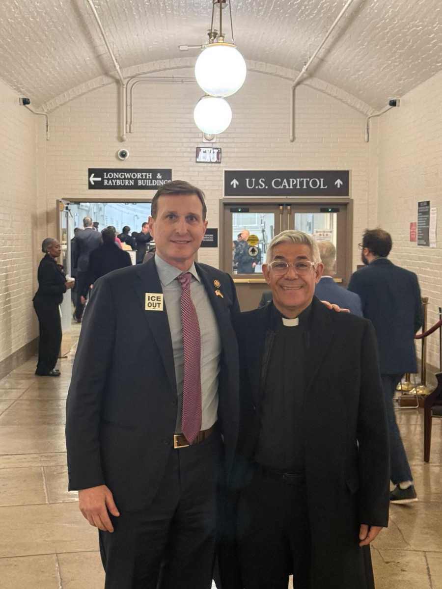 Congress member Dan Goldman with Father Arias at State of the Union for Trump