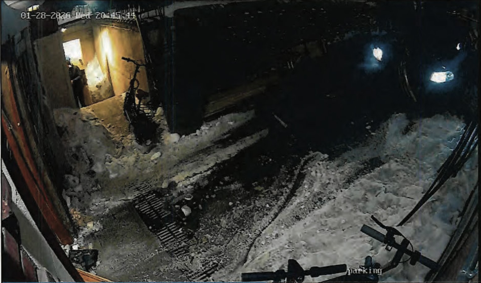 A still image taken from video footage shows the entrance door to Chabad Lubavitch World Headquarters in Brooklyn knocked off its hinges.