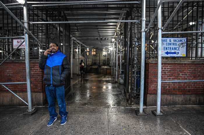 person standing in a building entrance